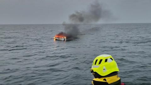 RNLI crew at scene of yacht fire