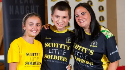 Scotty's Little Soldiers Nikki Scott and children