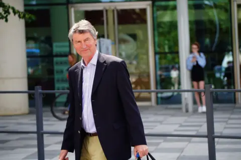 PA Vice Admiral Sir Tim Laurence leaves Southmead Hospital in Bristol after visiting his wife Princess Anne