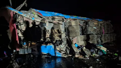 A wreckage of a bus from an accident 