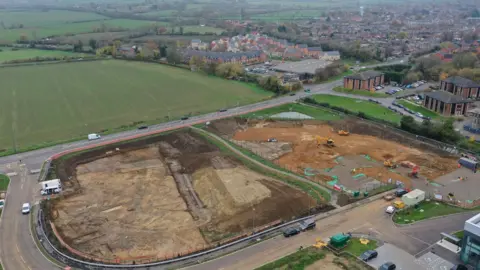 Oxford Archaeology An aerial shot shows the whole site being dug up