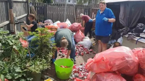 Miriam Whittham Cans being packed in bags