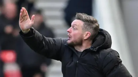 Middlesbrough manager Kim Hellberg scratches his head from the touchline as he tries to figure out their slump.
