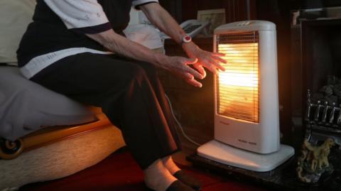 Person with heater