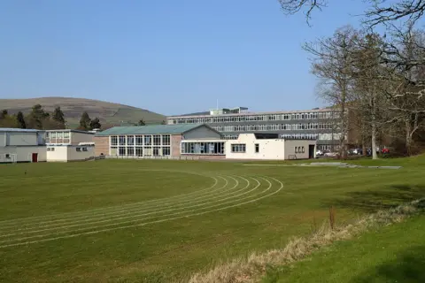 Walter Baxter The old Galashiels Academy in the Borders a very 1970s building with many windows and a running track in front of it