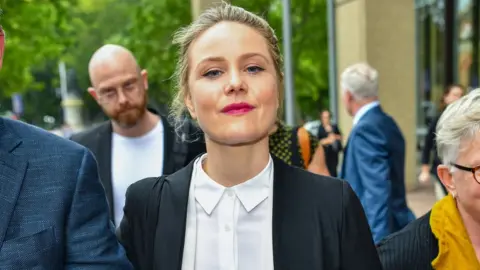 EPA Actress Eryn Jean Norvill outside the defamation trial
