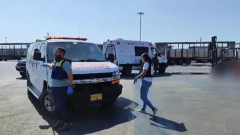 MDA An ambulance is seen near the crossing