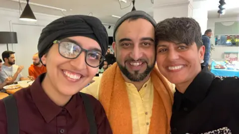 Sayyada with LGBTQI+ Imaan Sayyada and two other LGBTQI+ Imaan guardians smile for the camera as they break their fast during Ramadan
