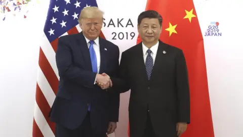 Getty Images Chinese President Xi Jinping (R) shakes hands with US President Donald Trump before a bilateral meeting during the G20 Summit on June 29, 2019 in Osaka, Japan.