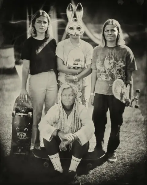 Jenny Sampson Portrait of a group of people with skateboards