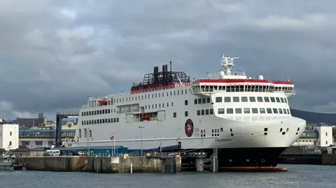 The Manxman ferry, which is in the Steam Packet colours of white red and black, moored in Douglas Harbour.