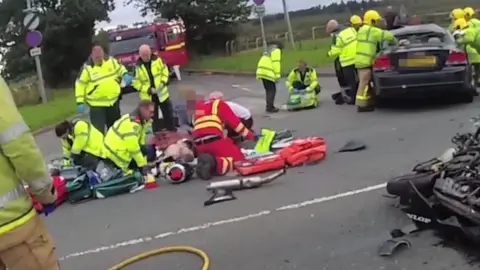 Cheshire Fire and Rescue Service Emergency services working on John O'Brien