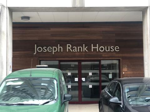 Joseph Rank House in Harlow with cars parked outside