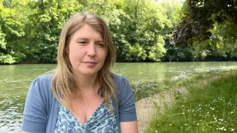 Dr Sam Mudie by the banks of the River Thames