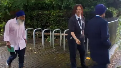Moga Singh and Gurpreet Digwa walking outside the court.