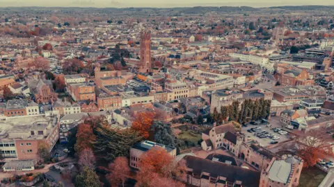 Getty Images Aerial view of Taunton. The trees are autumnal and St Mary Magdalene Church's tower can be seen.