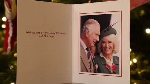 PA Media The 2022 Christmas card of King Charles III and the Queen Consort