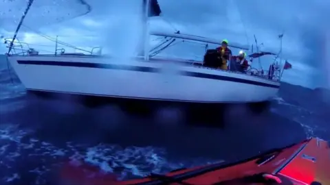 Port St Mary RNLI Photo of yacht in stormy seas with crew on board