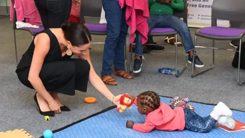 PA Media The Duchess of Sussex visiting mothers2mothers in Cape Town