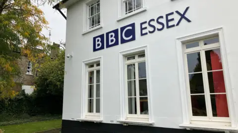 Lewis Adams/BBC The BBC Essex office, which is a white, two-storey building with BBC Essex lettering on it.