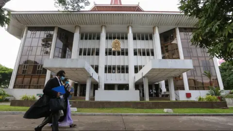 EPA Sri Lankan lawyers walk past the Supreme Court complex in Colombo, Sri Lanka, 20 May 2020