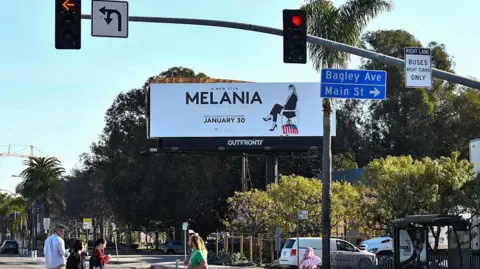 Getty Images A billboard on a busy street in LA advertises the film Melania 