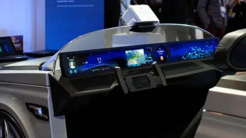 NurPhoto A car showcasing 5G intelligence exhibited by Qualcomm at Mobile World Congress in 2019