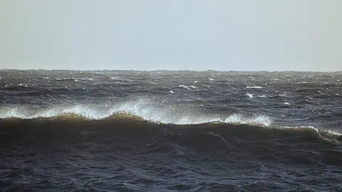 Sarah Giles A picture of the waves at Budleigh Salterton on Christmas Day.