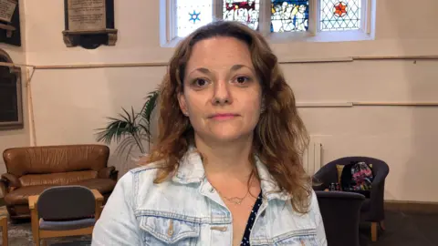 Naj Modak / BBC Maryana Mukha wearing a denim jacket