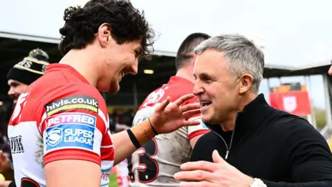 Jake Davies celebrates beating Wigan Warriors last month with St Helens head coach Paul Rowley.