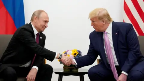 Reuters Russia's President Vladimir Putin and US President Donald Trump shake hands during a bilateral meeting at the G20 leaders summit in Osaka, Japan