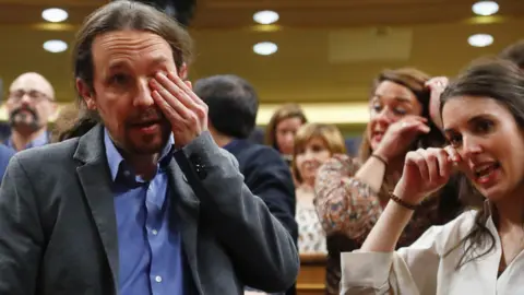 Reuters Podemos leader Pablo Iglesias and party member Irene Montero crying