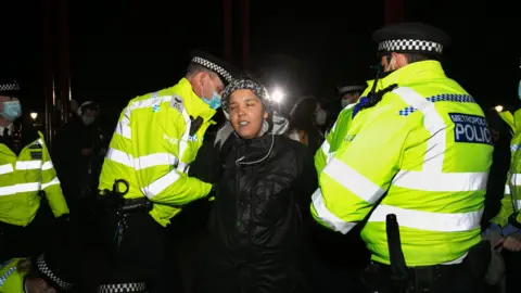 Getty Images Jade Cherelle Chambers is arrested by police during Saturday's vigil