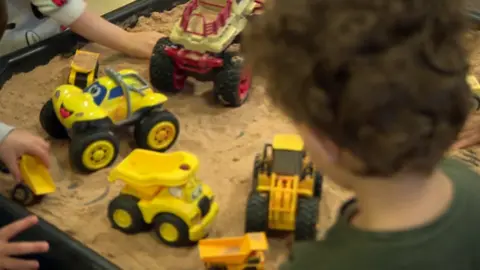 BBC Children playing in sandbox