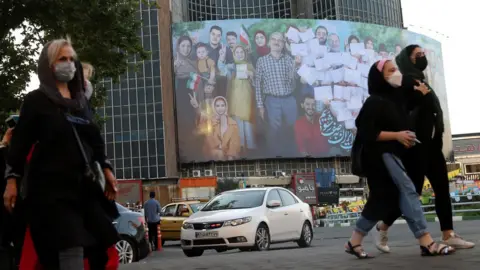 EPA A banner for the presidential election is seen in Valiasr square in Tehran, Iran (16 June 2021)