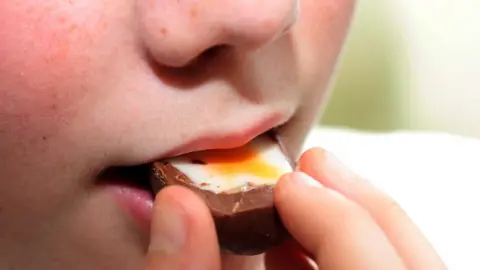 BBC Boy eating a Cadbury's Creme Egg