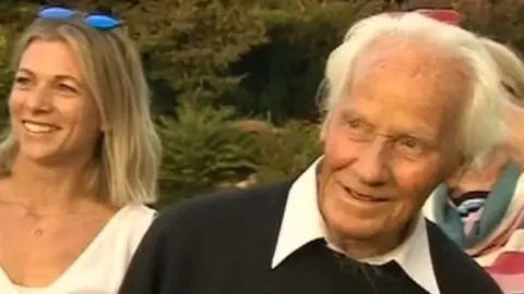 RAF veteran Eric Downs watching Spitfire flypast