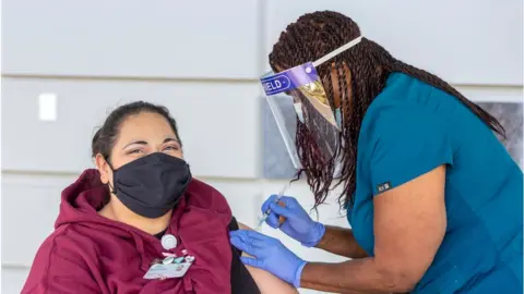 Getty Images California health workers get vaccinated