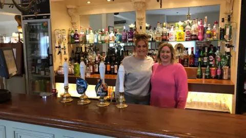 Darren Rozier/BBC Abby Woods and Elle Snellings who manage the Railway Inn