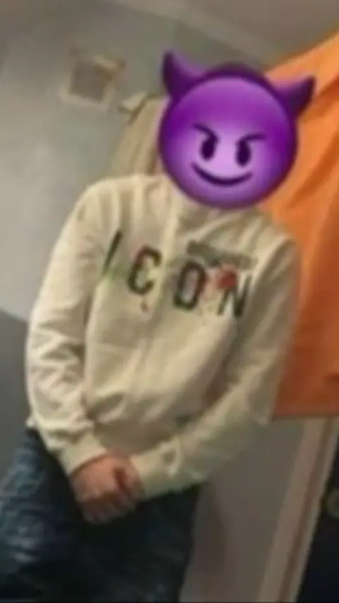 Person in Icon hoody with purple devil emoji on their head