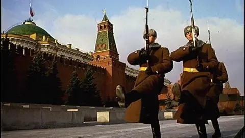 PA Media Two soldiers march on guard duty outside the Kremlin in Moscow.