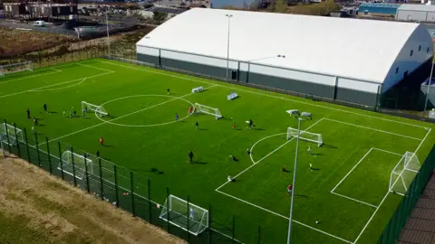 An aerial view of an artificial football pitch 