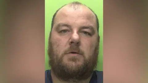 Nottinghamshire Police A mug shot of Callum Knott with a green background