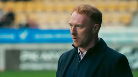 A close up of SJK Seinajoki manager Stevie Grieve at a football match