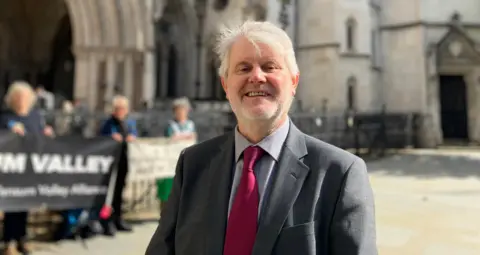 Andrew Boswell outside the High Court, London