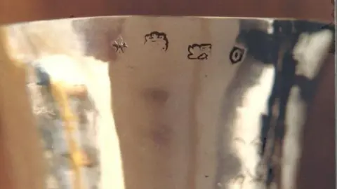 Avon and Somerset Police Four silver hallmarks on the outside of a silver chalice