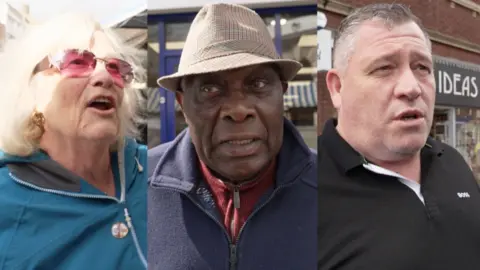 Three people in Walsall are in a split screen view. Far left is a woman with blonde hair, red-tinted glasses and green jacket. In the middle is a black man wearing a brown hat and blue fleece jacket. On the far right is a white man, with greying hair and wearing a black polo shirt.