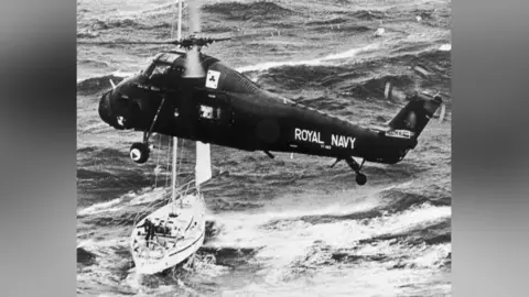 Getty Images A black and white photograph of a black helicopter 