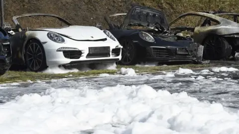 Reuters Burnt cars are seen at a Porsche showroom where a fire broke overnight ahead of the G20 summit in Hamburg, Germany, July 6, 2017.