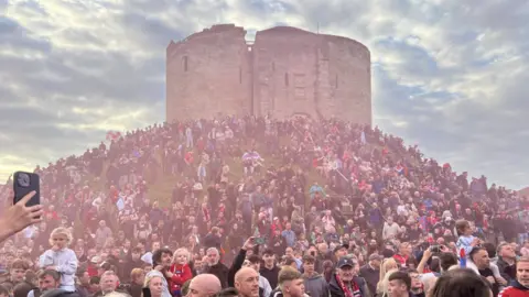Clifford’s Tower with the flares and the people on the hill